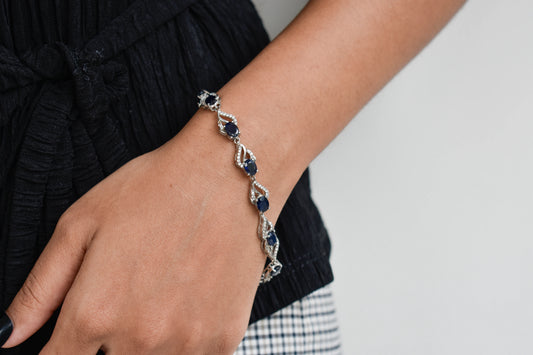 Blue gemstone oval tennis bracelet in 925 silver with pavé accents