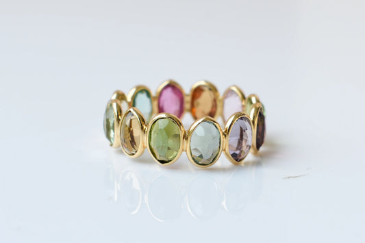 Oval-cut multicolor tourmaline double-row eternity ring in 18K gold