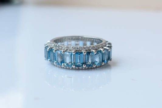 Sky blue topaz wide emerald-cut eternity ring in 925 silver