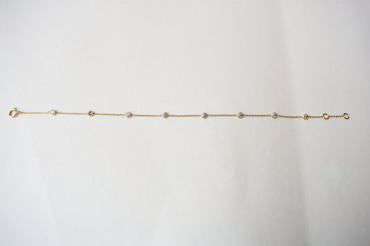 18K gold diamonds-by-the-yard bracelet with bezel-set round diamonds