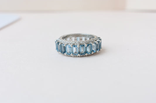 Sky blue topaz wide emerald-cut eternity ring in 925 silver