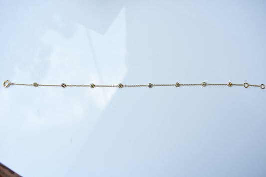 18K gold diamonds-by-the-yard bracelet with bezel-set round diamonds