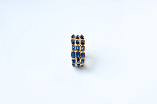 Baguette-cut blue sapphire three-row eternity ring in 18K gold