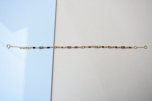 18K gold paperclip chain bracelet with multi-coloured sapphire stations