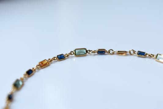 18K gold paperclip chain bracelet with multi-coloured sapphire stations