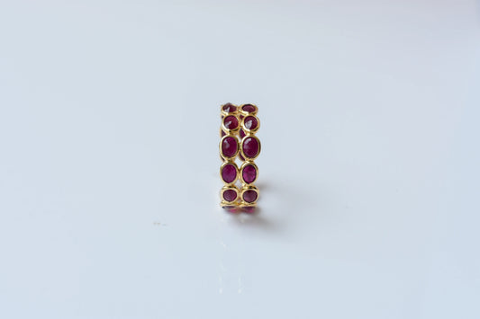 Oval-cut ruby honeycomb double-row eternity ring in 18K gold