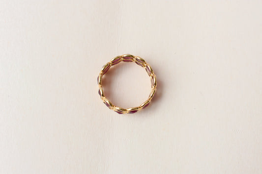 Oval-cut ruby honeycomb double-row eternity ring in 18K gold