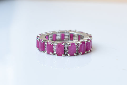Vivid pink gemstone emerald-cut eternity ring in 925 silver
