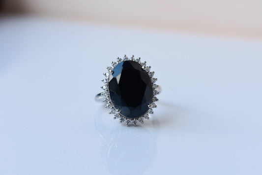 Oval black onyx halo ring in 925 silver with white cubic zirconia border
