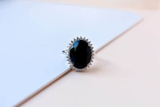 Oval black onyx halo ring in 925 silver with white cubic zirconia border
