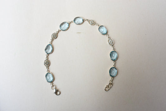 Blue gemstone bezel bracelet in silver with lobster clasp