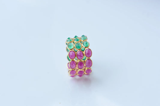 Two-tone emerald and ruby eternity ring in 18K gold
