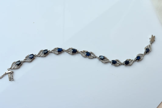 Blue gemstone oval tennis bracelet in 925 silver with pavé accents