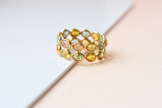 Pear-cut multicolor sapphire woven eternity ring in 18K gold, gold and citrine tones