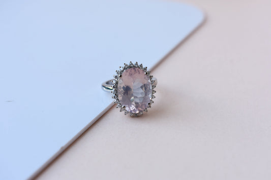 Oval rose quartz halo ring in 925 silver with cubic zirconia accents