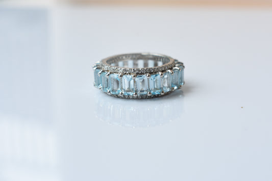 Sky blue topaz emerald-cut eternity ring in 925 silver
