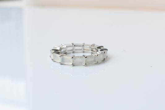Opalescent white baguette eternity ring in 925 silver