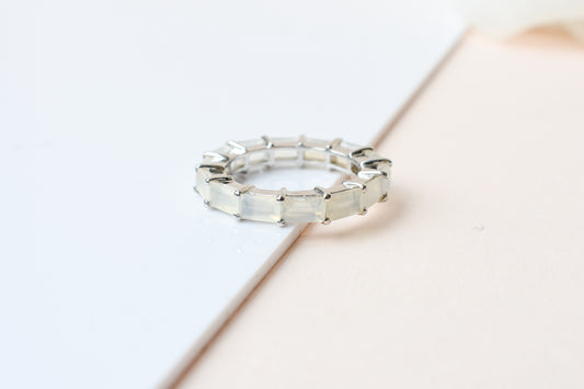 Opalescent white baguette eternity ring in 925 silver