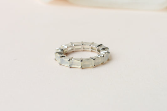 Opalescent white baguette eternity ring in 925 silver