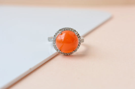 Round carnelian cabochon ring with cubic zirconia halo in 925 silver