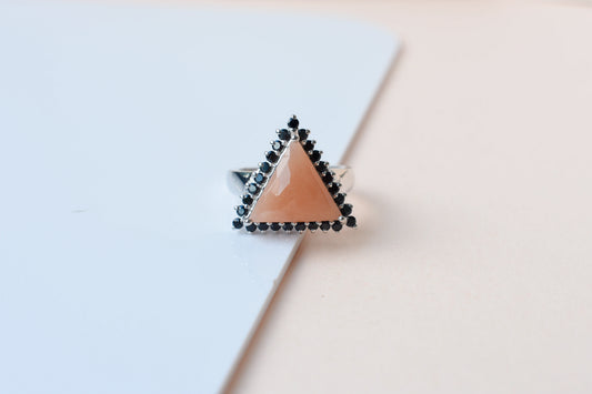 Triangular sunstone ring with black spinel halo in 925 silver