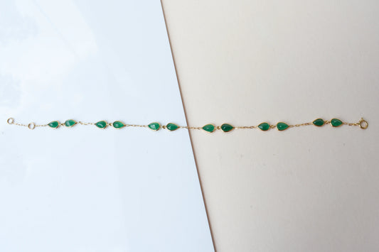 18K gold bracelet with pear-cut emerald drops