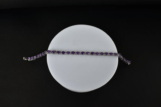 Oval-cut amethyst tennis bracelet with cubic zirconia accents in 925 silver
