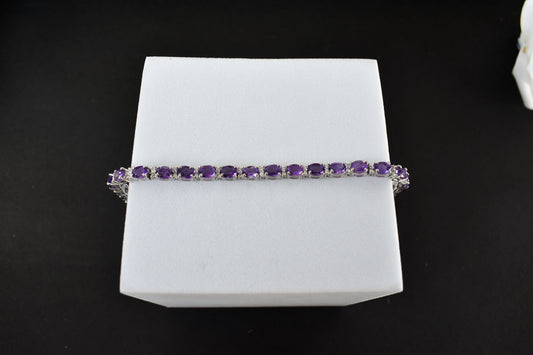 Oval-cut amethyst tennis bracelet with cubic zirconia accents in 925 silver