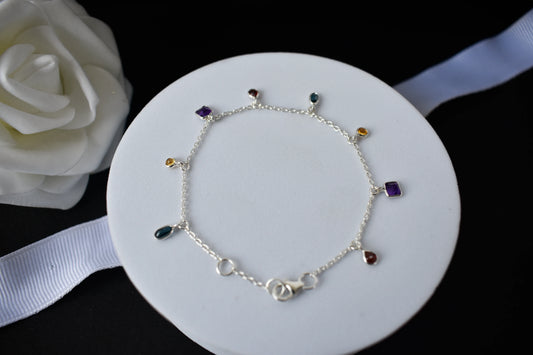 Multi gemstone charm bracelet with mixed-cut colored stones on a 925 silver chain
