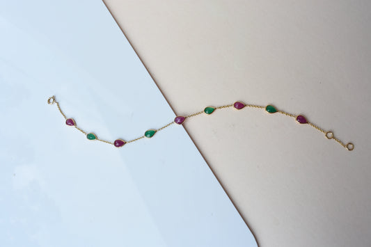 18K gold bracelet with alternating ruby and emerald drops