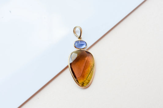 18K gold pendant with tourmaline slice and tanzanite accent
