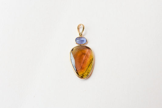 18K gold pendant with tourmaline slice and tanzanite accent