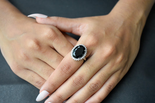 Oval black onyx halo ring in 925 silver with white cubic zirconia border