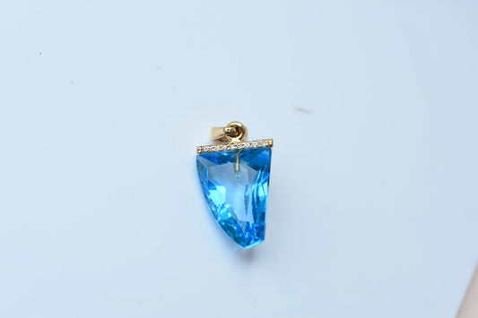 18K gold pendant with faceted blue topaz and diamond bail