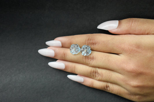 Carved blue topaz flower stud earrings with diamond centre