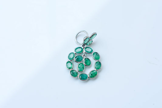 14K gold pendant with a wreath of bezel-set emeralds