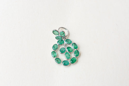 14K gold pendant with a wreath of bezel-set emeralds