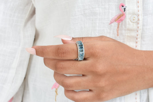 Sky blue topaz wide emerald-cut eternity ring in 925 silver