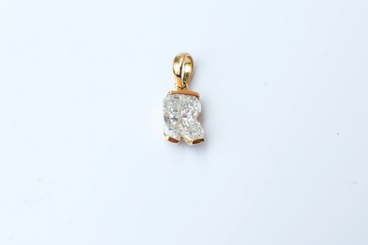 18K gold pendant with lab-grown diamond cut into the letter R