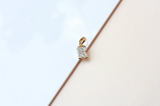 18K gold pendant with lab-grown diamond cut into the letter R