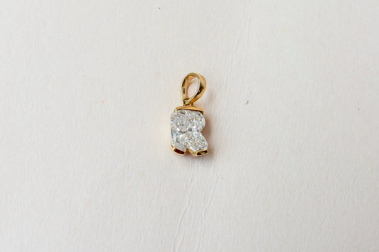 18K gold pendant with lab-grown diamond cut into the letter R
