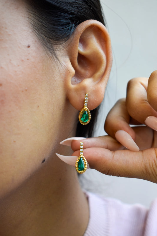 18K gold stud earrings with emerald and diamond accents