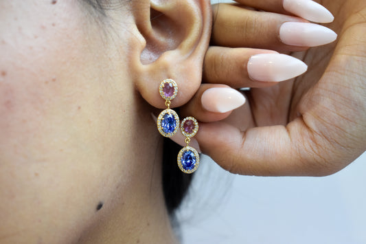 Gold drop earrings with pink and blue sapphire diamond halos