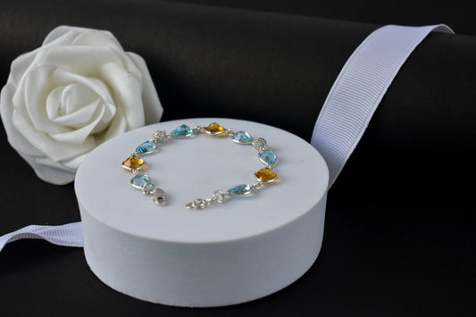 Citrine and blue topaz dangle bracelet with cubic zirconia accents in 925 silver