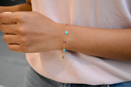 18K gold bracelet with turquoise and ruby stations