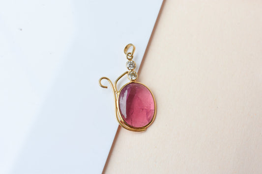 18K gold pendant with cabochon pink tourmaline and diamond accents