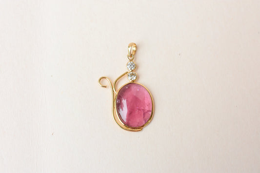 18K gold pendant with cabochon pink tourmaline and diamond accents