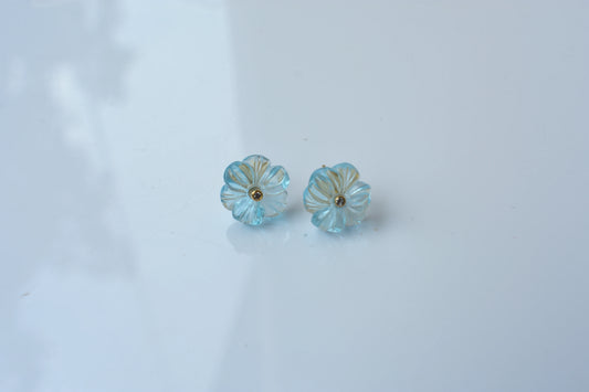 Carved blue topaz flower stud earrings with diamond centre
