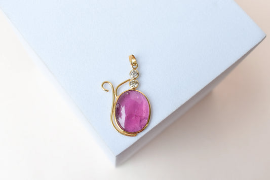 18K gold pendant with cabochon pink tourmaline and diamond accents
