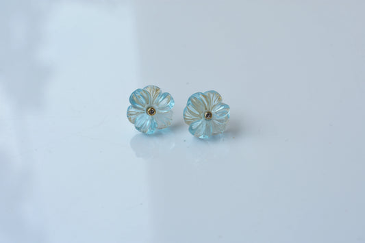 Carved blue topaz flower stud earrings with diamond centre